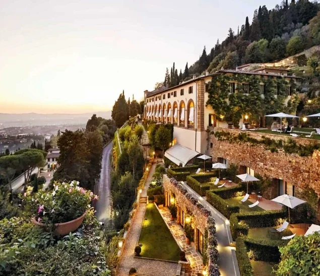 Hillside villa with terraced gardens above Florence at sunset, Tuscany, Italy